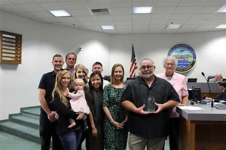 Tom Eynon recieves the Mayor's Award from Mayor Cheryl Brothers